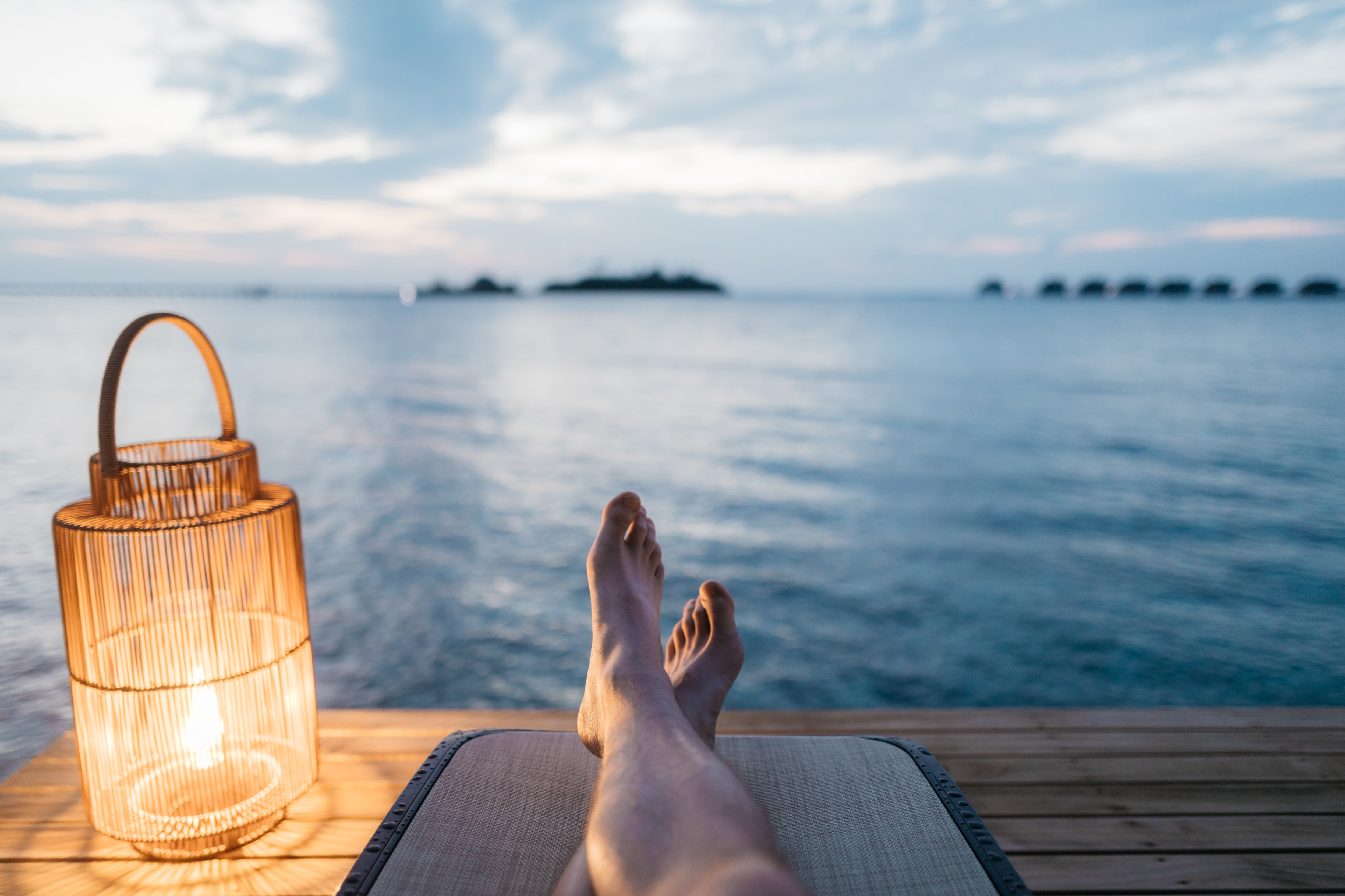 A person relaxing next to a lake